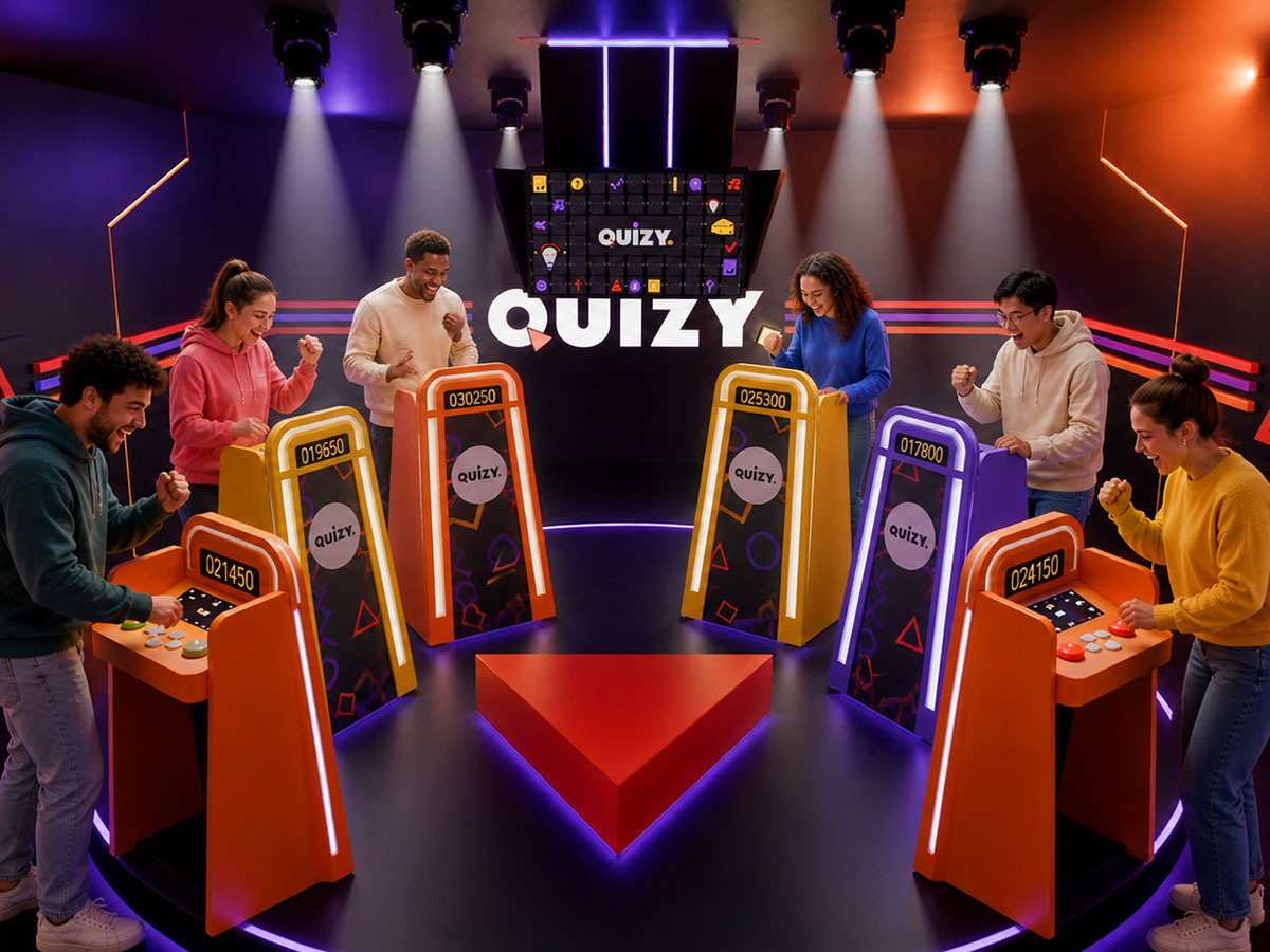 Participants enthousiastes jouant à un quiz interactif dans une salle immersive Quizy.